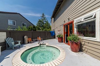 a small pool sits in the backyard of a house at Quartz Creek, Mountlake Terrace, WA, 98043